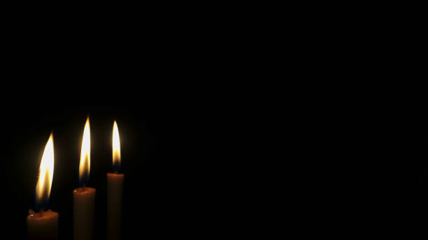 istock Candles burning in the dark 1455718180
