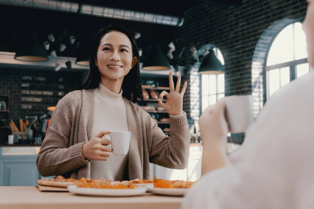 istock female hand holding slice of pizza 1455718673