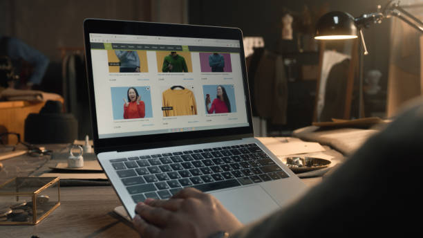 istock Client browsing online shop in atelier 1455719788