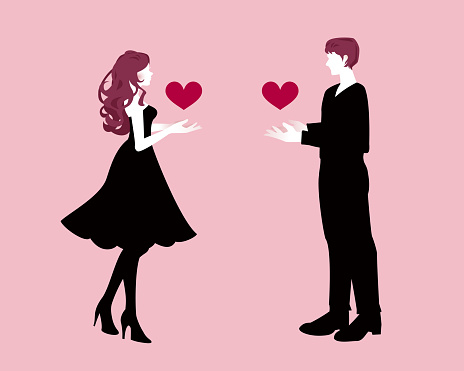 Silhouette Vectors. Both the man and the woman hold heart shaped objects in their hands. It is a symbol of their love for each other. Pink background.