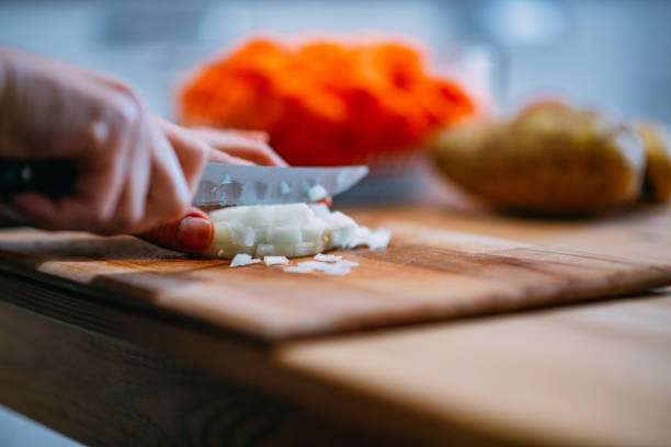 istock Woman Chopping Onions 1455723675