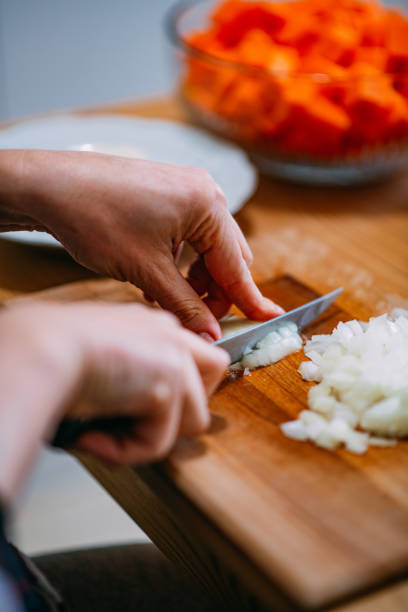 istock Woman Chopping Onions 1455723723