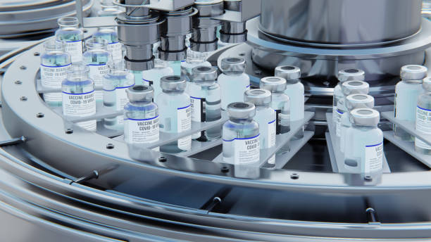 istock Close up 3d render. Covid-19 vaccine manufacturing, machine puts caps on bottles vials passing on conveyor belt. Clear blue liquid. 1455725977