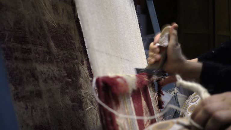 Women Weaving a handmade carpet