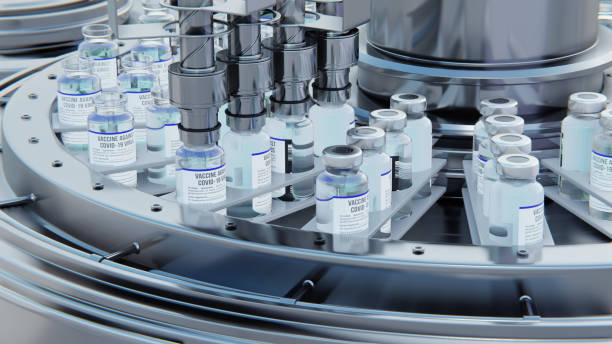 istock Close up 3d render. Covid-19 vaccine manufacturing, machine puts caps on bottles vials passing on conveyor belt. Clear blue liquid. 1455726517