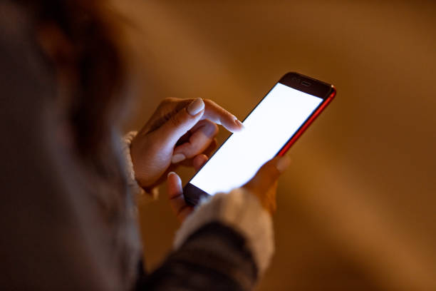istock Close up of a woman using smart phone 1455726953