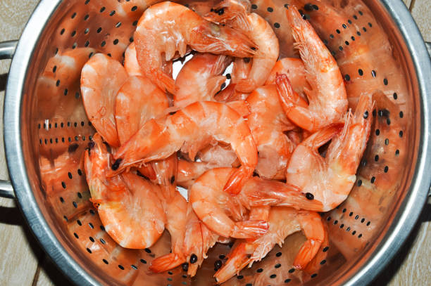 istock fresh shrimp. seafood. cooking. background for the design. 1455731960
