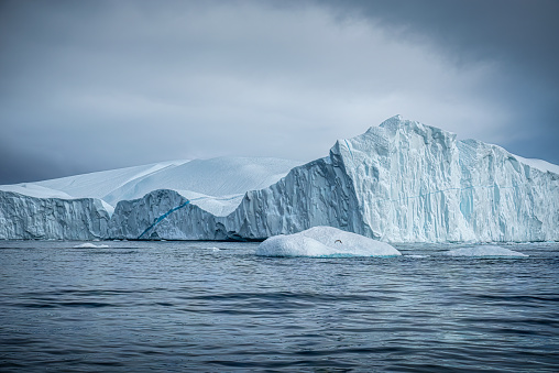 Giant icebergs floating in the arctic sea at Ilulissat Icefjord. Greenland
