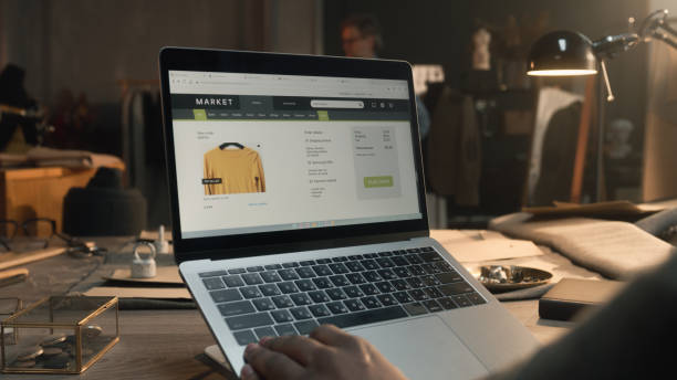 istock Client browsing online shop in atelier 1455732484