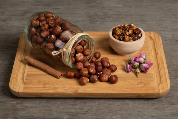 Hazelnuts poured from the jar on the serving plate Nuts , vegan , organic , diet , muesli ,  natural food ,raw food renkli fotoğraf stock pictures, royalty-free photos & images