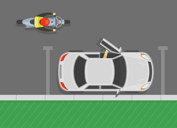 istock Driver opening the vehicle's front door while motorcycle is approaches. Beware of the door zone. Top view. 1455743584