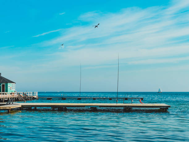 istock seascape with piers and blue sky in the background 1455743798