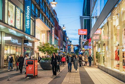 Stockholm, Sweden - Stockholm's central retail streets busy with pedestrians on an evening in September.