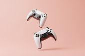 Flying gamepad on a pink background with copy space. Joystick for video game. Game controller. Creative Minimal Gaming concept. Front view. 3D rendering illustration