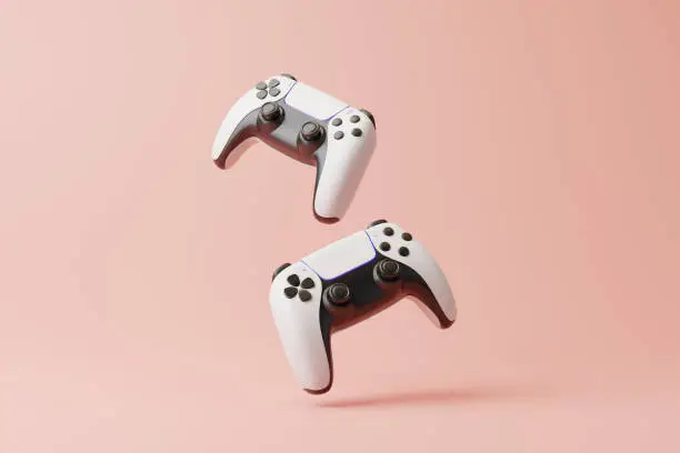 Photo of Flying gamepad on a pink background with copy space. Joystick for video game. Game controller. Creative Minimal Gaming concept. Front view. 3D rendering illustration