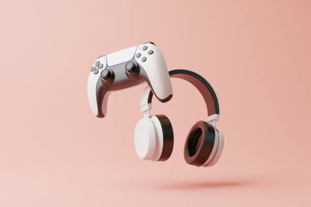 istock Flying gamepad and headphone on a pink background with copy space. Joystick for video game. Game controller. Creative Minimal Gaming concept. Front view. 3D rendering illustration 1455747237