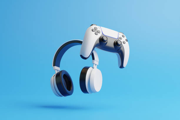 istock Flying gamepad and headphone on a blue background with copy space. Joystick for video game. Game controller. Creative Minimal Gaming concept. Front view. 3D rendering illustration 1455747296