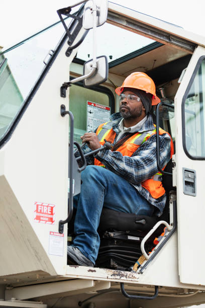 istock African-American man operating crane 1455753294