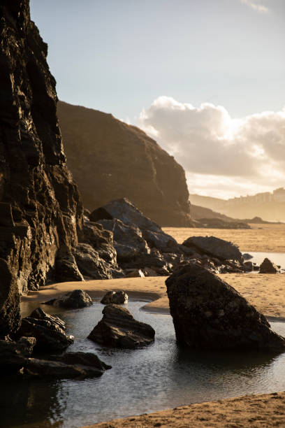 istock The afternoon sun playing off the cliffs at Perranporth Beach. 1455753558