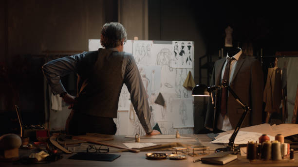 istock Tailor works with sketches of future clothes 1455753606