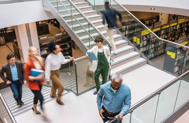 istock Business people walking up or down the staircase 1455753762