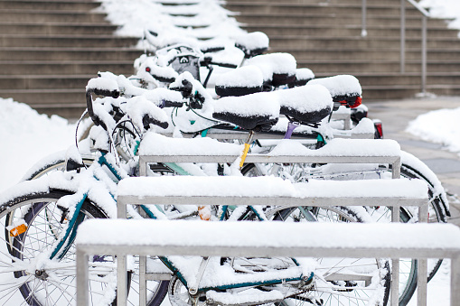 Snow-covered bicycles