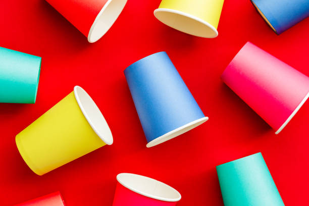 istock Colorful recyclable paper cups on red background 1455754125