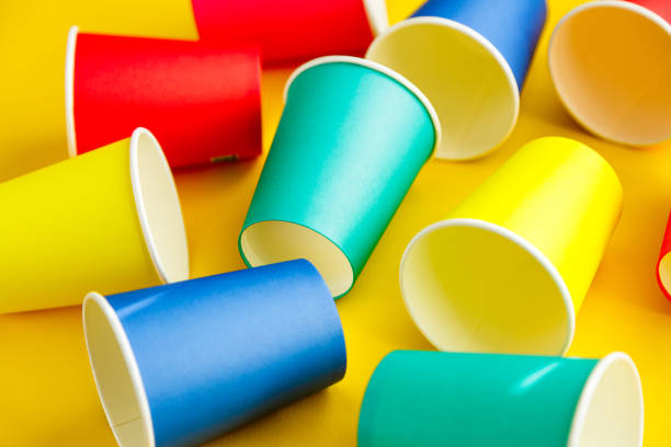 istock Colorful recyclable paper cups on yellow background 1455755217