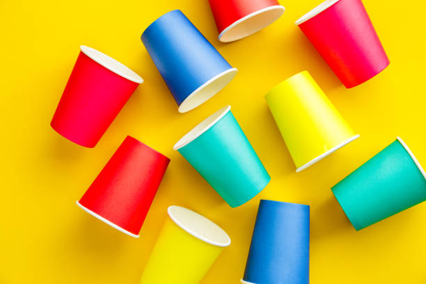 istock Colorful recyclable paper cups on yellow background 1455755221