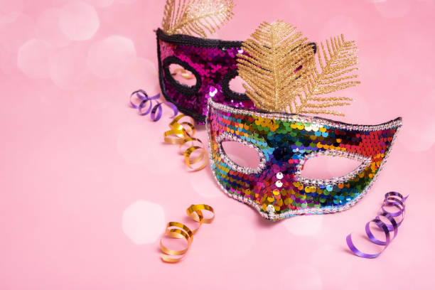 istock Festive face mask for carnival celebration on colored background with bokeh 1455762096