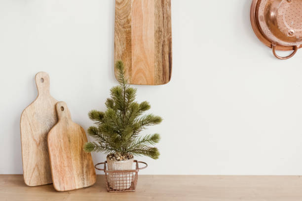 istock Wooden cutting board near white wall 1455762273