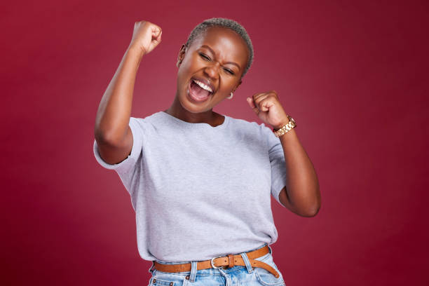 celebration, black woman and excited person showing happiness and winner feeling. winning motivation, achievement and happy smile of a female win with a celebrate victory feeling from success - women female cheerful ecstatic imagens e fotografias de stock