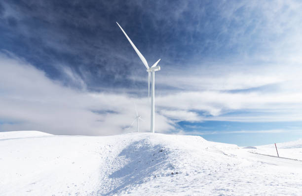 istock Wind turbines on snow covered mountain. 1455764451