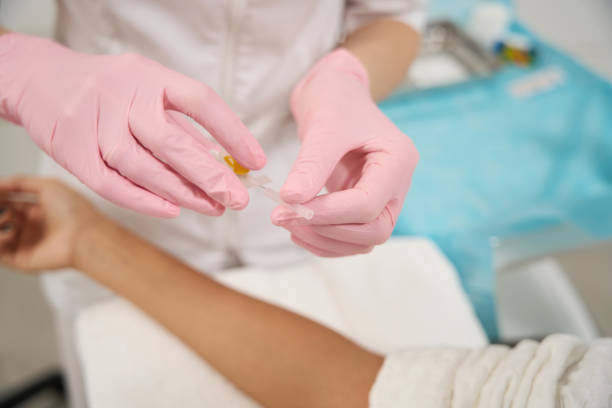 istock Cosmetologist getting ready to take blood test 1455764516