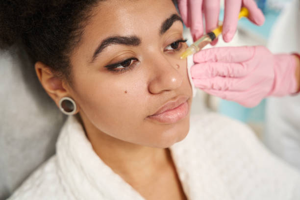 istock Medical worker doing facial plasmolifting for young lady 1455765060