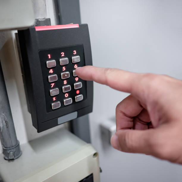 istock Male finger pressing password number on digital door lock 1455765560