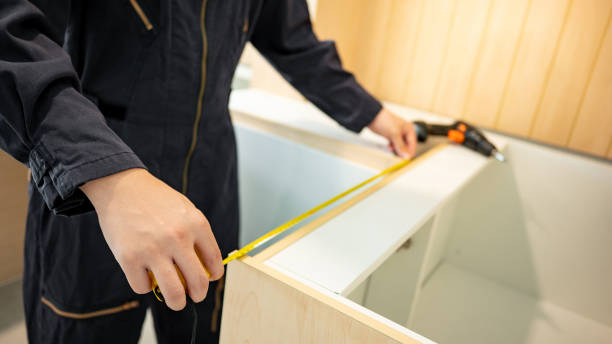 istock Male hand furniture assembler using tape measure 1455765631