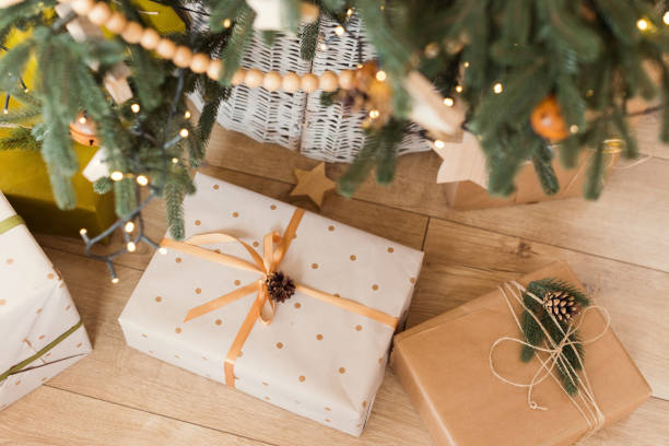 istock Christmas gift boxes near Christmas tree 1455765679
