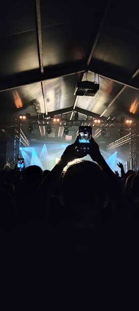 istock taking picture at the concert 1455768731