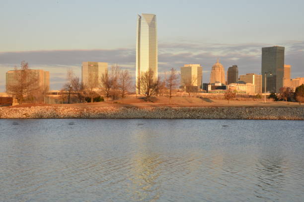 istock Oklahoma River Against Skyscrapers On Calm Cloudy Morning 1455769548