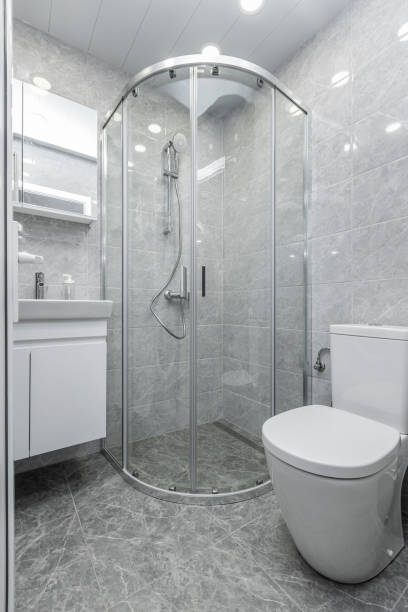 istock Modern shower room with gray tiles 1455770598