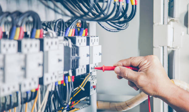 istock Electrical engineer checking the operation of electrical control cabinet, maintenance concept. 1455770689