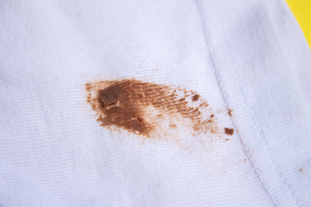 istock Chocolate stain on white shirt 1455771312