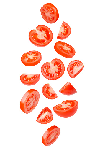 Flying tomatoes cut into different shapes. Tomatoes, tomatoes, cut, fresh tomatoes. Isolated.
