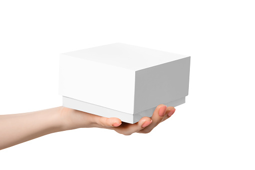 White box on a female palm, without inscriptions, isolate on a white background.