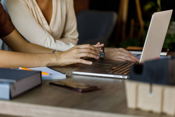 istock Two businesswomen co-working on a mutual project at the office 1455773038
