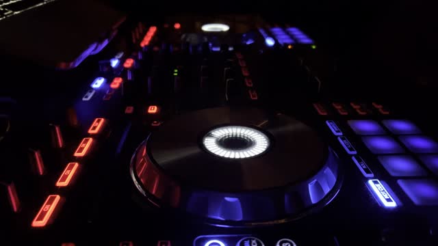 DJ controller and its blinking lights at the night club