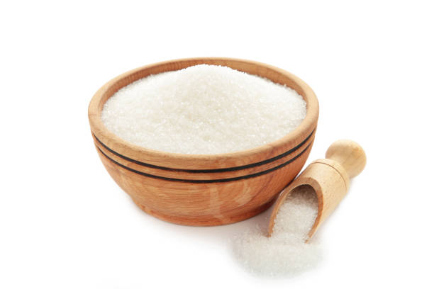 istock Bowl of white sugar isolated on white background 1455774403