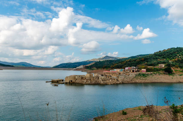 The artificial dam of Aposelemi and the abandoned sunken village of Sfendili stock photo