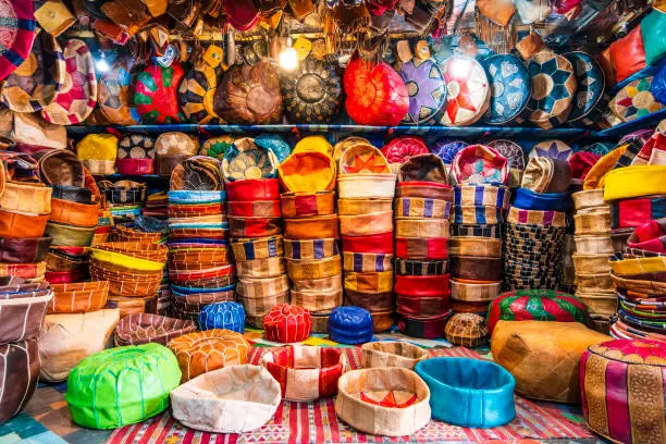 Variety of leather poufs sold in huge shop next to tannery in Fes, Morocco, North Africa